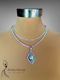 Necklace with a colorful pendant on a mannequin, branded 'Petra Polak Designs'.