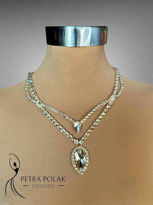 Necklace with a large pendant on a mannequin with 'Petra Polak Designs' branding.