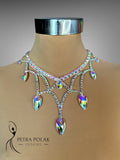 Elegant necklace on a mannequin with 'Petra Polak Designs' branding.
