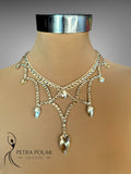 Elegant necklace on a mannequin with 'Petra Polak Designs' branding.