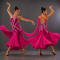 Dancer in a pink dress with flowing fabric on a gray background