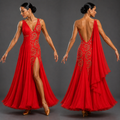 Red evening gown with intricate detailing on a gray background
