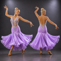 Dancer in a purple gown with a backless design, performing on a dark background.