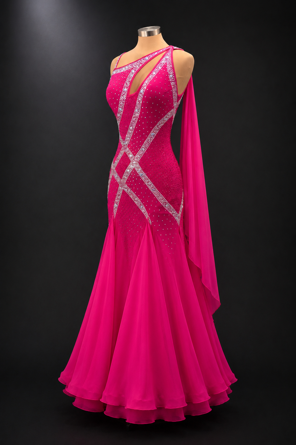 Pink gown with silver embellishments on a mannequin against a black background