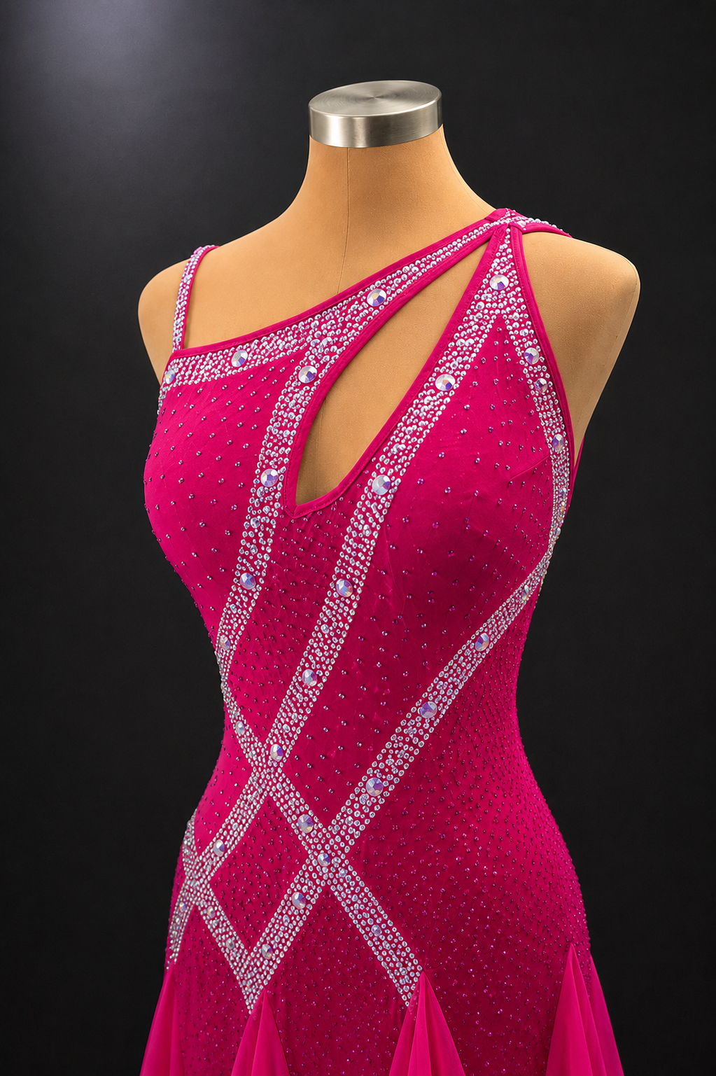 Pink dress with intricate silver beadwork on a mannequin against a black background