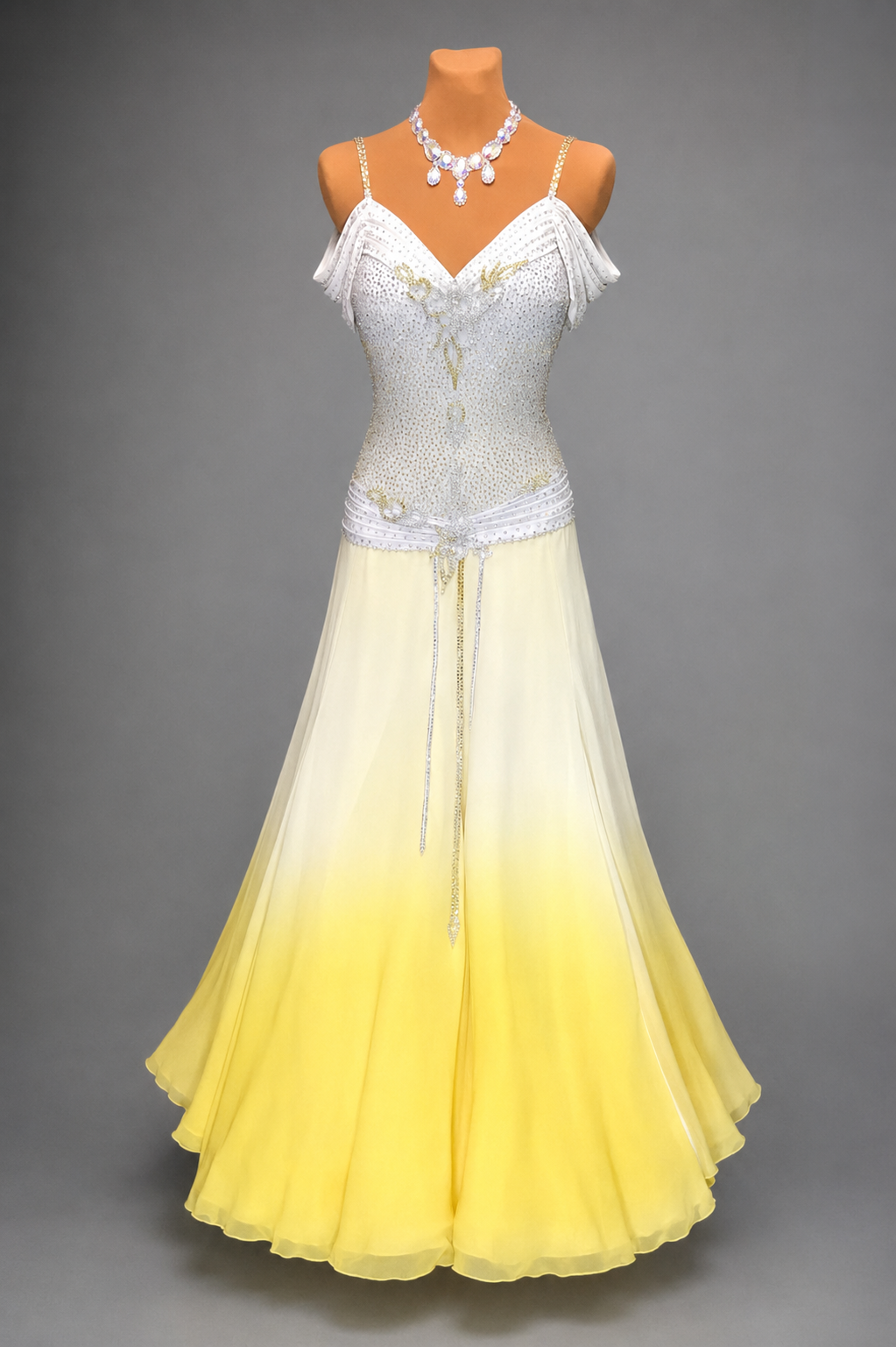Mannequin wearing a white and yellow dress with a gray background