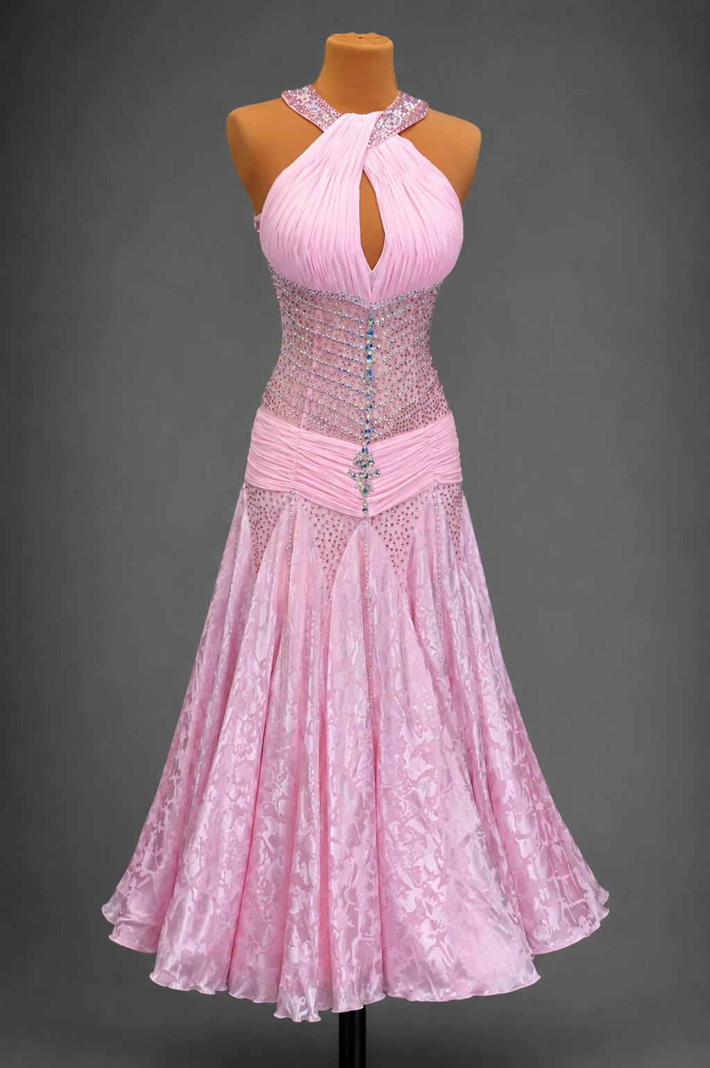 Pink dress on a mannequin against a gray background