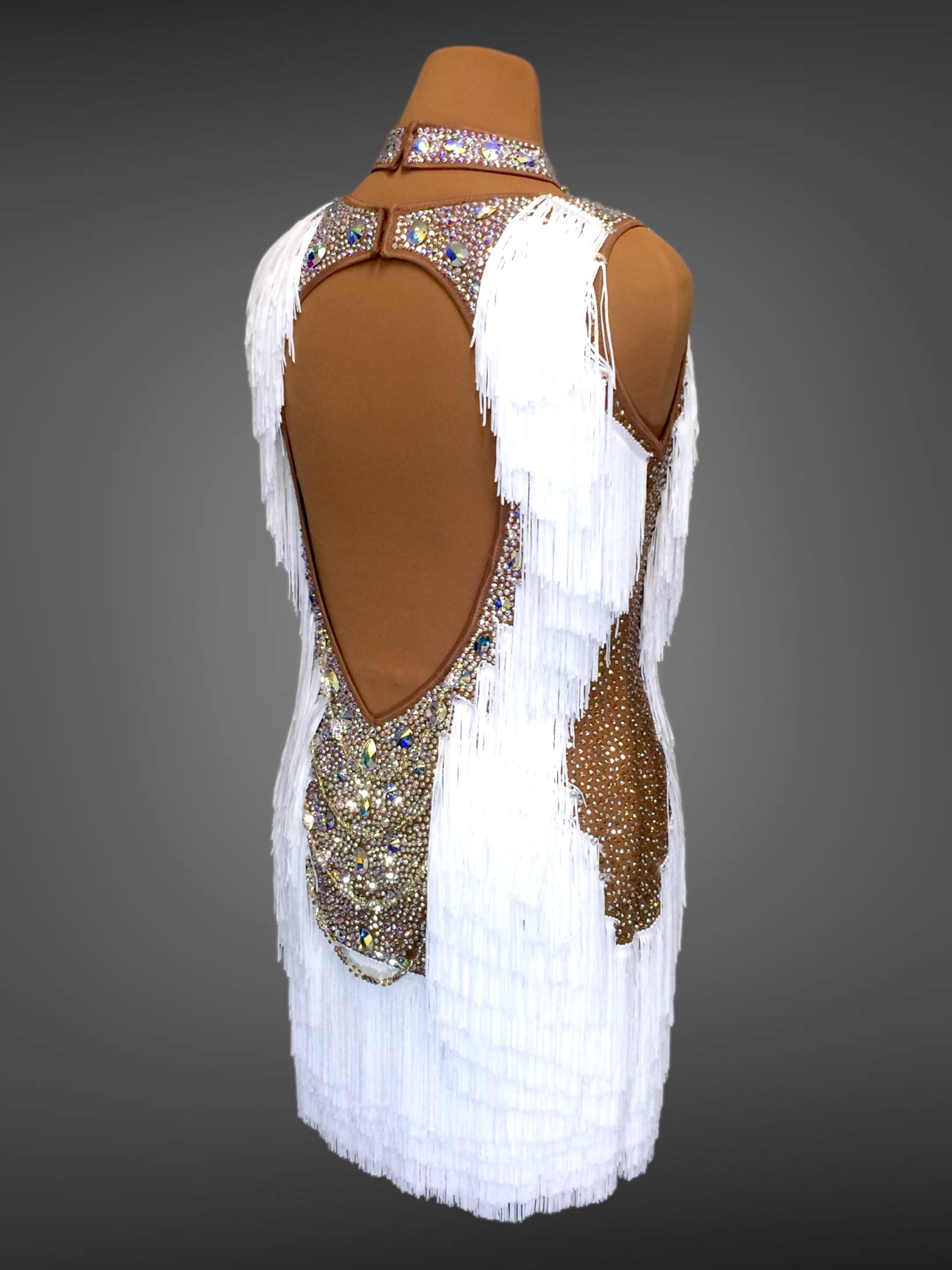 Decorative dress with sequins and beads on a gray background